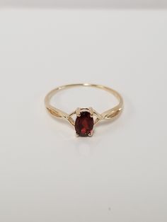 "Thanks for shopping our vintage estate store. We tend to sell well below wholesale and truly hope you enjoy all of our items. Many of the items are one of a kind, so please enjoy scrolling through the pictures and hopefully something will catch your eye. Brown spots are from reflections. Estate 10k yellow gold natural .50ct garnet midi or birthstone ring. Ring size: 7 Setting: 6mm by 4mm 1/4\" Band width: 1mm Weight: 1.0 gram Beautiful ring. Marked 10k." Beach Rings, Gold Halo, Garnet Ring, Brown Spots, Band Engagement Ring, Engagement Bands, Garnet Rings, Cz Diamond, Beautiful Ring