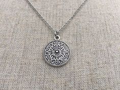 This is a understated and elegant little boho disc pendant necklace.  It is perfect for everyday wear and would go with just about anything.  The disc measures 3/4” long by 5/8” wide and is made from allergy free plated silver.  It hangs from a simple stainless steel necklace chain.I have matching earrings in my shop, if you would like the whole set.  Here is the link.......... https://etsy.me/2VZ551y Thanks for stopping by!  Please take a moment and visit the rest of my Etsy shop.    I have man Silver Dainty Necklace For Festivals, Bohemian Sterling Silver Jewelry With Delicate Chain, Bohemian Silver Charm Necklace With Delicate Chain, Bohemian Sterling Silver Charm Necklace Nickel Free, Bohemian Silver Jewelry With Delicate Chain, Silver Delicate Chain Bohemian Jewelry, Silver Bohemian Jewelry With Delicate Chain, Bohemian Handmade Circle Necklace, Bohemian Circle Metal Necklace