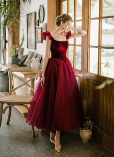 Product Information:Dress Number: GS2WMaterial: Tulle, VelvetSilhouette: A-lineColor: Wine RedHemline: Tea LengthBack Detail: Lace-upNormal Order Delivery time:Tailoring Time: 2-3 weeksShipping time: 3-5 working daysFor normal order, you can receive your order in 3-4 weeks.Rush Order:Rush order service is available. For rush order, you can receive your order in 14 working days.Custom Size:We offer free custom size service. Please leave us the following measurements according to the measuring guide:Bust: ________inch/cm,Waist: ________inch/cm,Hips: ________inch/cmHollow to knee( for knee length dress only):________inch/cmHollow to Floor(without shoes): ________inch/cm Your Height without shoes______ inch/cmThe Shoes height you will wear with the dress:______ inch/cm Simple Short Bridesmaid Dresses, Prom Dress Cute, Tea Length Prom Dress, Chiffon Party Dress, Tulle Party Dress, Multi Way Dress, Cute Homecoming Dresses, Velvet Prom Dress, Floral Dress Formal