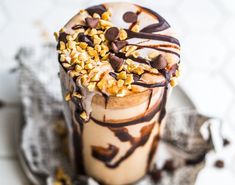 an ice cream sundae with chocolate and nuts on top