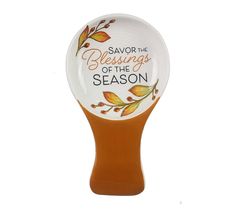 a brown and white spoon with the words saying, savor the blessing of the season