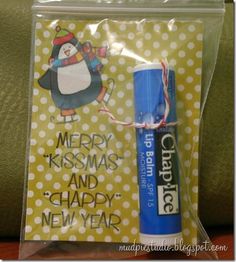 a pack of lip bales with a penguin on it and merry kissmas and happy new year message