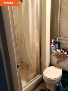 a white toilet sitting in a bathroom next to a bath tub covered in plastic wrap