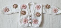 flower cardigan,toddler handknitted cardigan,chunky flower jacket, baby girl clothig, hand knit cute cardigans,trendy sweater Handmade baby girl cardigans can be knitted for It can be personalized with color options. 👚 1. Quality knitting rope is used. Color options can be personalized. 🧶 It is a very good choice for gifts on special occasions such as birthday, Christmas, newborn baby, toddlers, baby shower to new mothers. 🎁 The preparation time of the product is 1 week. The time is a little Cute Handmade White Cardigan, White Handmade Cute Cardigan, Cute White Hand Knitted Cardigan, Cute White Hand-knitted Cardigan, Cute White Crochet Cardigan, Cute Hand Knitted Cardigan, Toddler Girl Cardigan, Flower Jacket, Toddler Cardigan