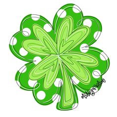 a green four leaf clover with white polka dots