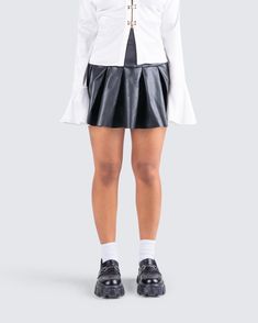 Fun and flirty, but dark and mysterious - make them work to figure you out in this black skirt 😏 Made from faux leather, boasting a box pleat, and invisible side zipper 🖤 Leather Pleated Black Skirt, Leather Skirt Mini Pleated, Faux Leather Mini Pleated Skirt, White Satin Shirt, Luxury Black Leather Skirt, Luxury Black Leather Mini Skirt, Vegan Leather Skirt, Orange Satin, Dress Gloves