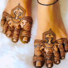 the feet are decorated with henna designs