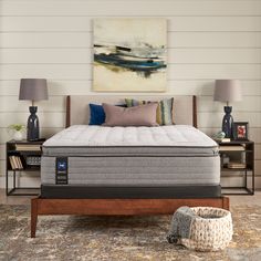 an image of a bedroom setting with mattresses and pillows on the bed side table