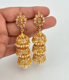 Gold Plated Polki Jhumka/Polki stone Jhumka/Indian Jewelry/Pakistani/Punjabi/Indian/Statement earring/Bridal earring/Indian wedding Double Jhumki length 2.4 inches, width 0.9 inches Triple Jhumki length 3.1 inches, width 0.9 inches Lightweight and elegant Can be paired with any dress Closure: Pushback This is 100% Handmade jewelry. So Color, shades, texture displayed may slightly vary from the actual product due to digital image limitations. We request you to consider these minor variations. Ple Luxury Round Bollywood Jhumkas, Luxury Temple Jewelry Chandbali Jhumkas, Luxury Yellow Gold Fusion Jhumkas, Luxury 22k Gold Bollywood Bridal Earrings, Luxury Bollywood Multicolor Jhumkas, Dangle Jhumkas With Latkans For Weddings, Dangle Latkan Jhumkas For Weddings, Wedding Dangle Jhumkas With Latkans, Diwali Reception Drop Jhumkas Earrings