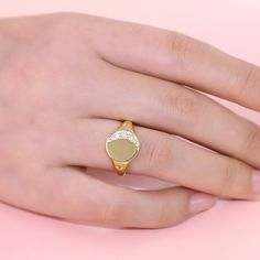 This yellow gold tone signet ring has an moon and star encrusted for extra sparkle. Five round brilliant white stones are set in sterling silver to form a perfect Crescent Moon. Just the right amount of glimmer. An out of this world design with lots of sparkling personality.Carat Weight: 0.605 ctStone Size: 1.5,2.2,2.5 mmStone Type: Jeulia® StoneNumber of Stones: 7 Stone Shape: RoundStone Color: Diamond WhiteWeight: 4.4 gWidth: 2.4 mmHeight: 3.35 mmThickness: 1.1 mmMaterial: 925 SilverPlating Color: Yellow Gold Gold Oval Signet Ring With Pave Setting, Gold Oval Signet Ring With Diamond Accents, Oval Gold Signet Ring With Diamond Accents, Gold Signet Ring With Brilliant Cut, Celestial Style Diamond Signet Ring In Yellow Gold, Gold Signet Ring With Diamond Accents For Promise, White Gold Diamond Signet Ring, Tarnish Resistant, Gold Celestial Signet Ring Stamped 14k, Celestial Gold Signet Ring Stamped 14k