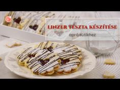 some cookies are on a plate with white icing and chocolate drizzles