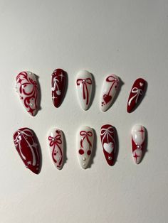 Dainty red coquette cherry bow themed press on nails with pearl detailing! --> Nail shape + length:  medium stiletto dm on instagram (@stxrnails) for a different nail shape/length :) prices may change depending on nail length! 🎀All orders ship in bubble wrap mailer with a file, nail glue, cuticle pusher and stickers :D 🎀If you need custom sizes make sure to include in the personalization section!! Thumbs ib: @oaklestudio on ig My IG: @stxrnails Christmas Theme Nail Art Design, Christmas Nail Mistletoe, Read Nails Design, Crazy Cute Nail Designs, Red Acrylic Nails Designs Christmas, Red And Cream Nails Design, Nail Inspiration Red And Black, Nail Inspo 11-12 Yo, Red French Tip Nails With Bow Square