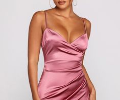 Wrap yourself in a luxe satin dress that brings the glamour to your next night out. The dress features a sleeveless V-neckline. spaghetti straps. ruched side seam. and a mini length silhouette with an asymmetrical hem. The dress is composed of a lined satin-like fabric that offers a form hugging fit with a moderate stretch. Complete look with heels and clear mules.Fit & Features Sleeveless V-neckline Spaghetti straps Ruched side seam Mini length silhouette Asymmetrical hem Lined satin fabric For Clear Mules, Satin Mini Dress, Maxi Dresses Casual, Satin Dress, Asymmetrical Hem, Club Dresses, Asymmetric Hem, Satin Dresses, Satin Fabric