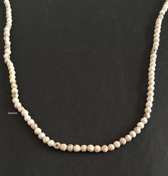 "Tulsi Mala Necklace. This beaded necklace can be worn by men as well as women. Tulsi beads are made from Tulsi (Holy Basil) plant wood, considered as most sacred in India. Tulsi plant is worshipped in India and the food offered to Indian Gods is incomplete without the offereing of Tulsi leaves along with it. Tulsi Mala provides protection to the wearer and is said to maintain Health, provide Peace of Mind and reduce Stress. They are used to worship Lord Krishna to honour him and to get his bles Natural Beaded Necklaces With Round Beads, Natural Round Beaded Necklaces, Adjustable Natural Color Necklaces With Round Beads, Adjustable Natural Round Beads Necklaces, Adjustable Natural Color Beaded Necklaces With Round Beads, Adjustable Natural Beaded Necklaces, Adjustable Natural Round Beaded Necklaces, Natural Wooden Beads Necklace, White Spiritual Necklace With Tiny Beads