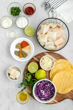 the ingredients for this mexican dish are laid out on a cutting board and ready to be eaten