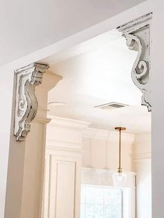 an ornate mirror frame in the middle of a kitchen