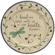 a plate with a quote on it that says, a loved one stays with us in our heart forever