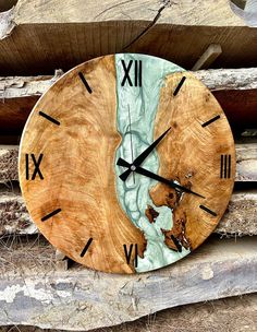 a clock made out of wood with the world on it's face and hands