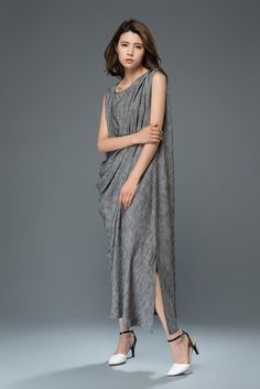 Combine your bright personality with the gorgeous details of this linen cocktail dress and you'll make an entrance no matter what the occasion is. The beautiful drape towards the ankles will create a stunning silhouette that everyone will be envious of! The linen cocktail dress boasts a draped effect across one shoulder and it falls to ankle length. This elongates the body and will make any lady look ultra-slim. This is a fab dress you'll be able to wear for many different types of occasions. Yo Asymmetrical Linen Midi Dress For Summer, Casual Asymmetrical Linen Dress, Asymmetrical Linen Midi Dress, Chic Linen Dress With Asymmetrical Hem, Summer Party Linen Midi Dress, Elegant Asymmetrical Linen Dress, Elegant Sleeveless Dress With Asymmetrical Hem For Beach, Linen Maxi Dress With Asymmetrical Hem, Asymmetrical Linen Beach Dress