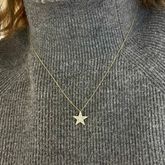 We know you'll love this necklace! A dainty 18k gold cable chain houses a stunning pave diamond star. It’s simple yet sophisticated design allows for everyday wear. Metal: 18k White Gold / 18k Yellow Gold / 18k Rose Gold Round Brilliant Cut Natural Diamonds: Approx. 0.40 ctw G/H Color and SI Clarity Diamonds Length: 16 inches at the longest with jump rings at 14” & 15” Closure: Lobster Clasp Pendant Measurements: approx. 14.1mm x 13.3mm Looking for a different length? Please email us. 14k Gold Star Necklace With Single Cut Diamonds, College Rings, Diamond Star Necklace, Resize Ring, Collar Chain, Diamond Star, Band Bracelet, Bridal Bands, Tennis Necklace