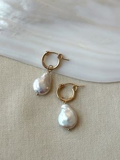 These stunning Coin Pearl Hoop Earrings are the perfect balance of bold and dainty! They make beautiful special occasion earrings, or remove the pearl charm and wear the hoops for an everyday casual style! These are some of the nicest quality Coin Pearls I have come across, and make a lovely gift for the woman you love. Pair them with the matching Coin Pearl Necklace to create a dreamy Pearl set! * 14mm (removable) genuine Coin Pearl charms * 13mm 14K Gold Filled or 925 Sterling Silver Leverback Bridal Pearl Earrings, Pearl Wedding Earrings, Coin Pearl Necklace, Pearl Earrings Wedding, Basic Jewelry, Bridal Earrings Pearl, Coin Pearls, Pearl Hoop Earrings, Wedding Jewelry Earrings