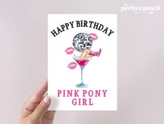 a woman holding up a card with the words happy birthday pink pony girl