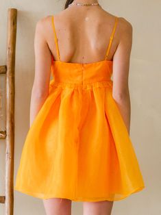 We are obsessed with the Clementine Organza Mini Dress!! Bengals season—but make it fashion! This puffy dress is so SO cute and sure to make you a stand out in any room! You will rock this! 100% Polyester Orange Sleeveless Dress For Holiday, Orange Summer Dresses For Holiday, Orange Flirty Dress With Spaghetti Straps, Orange Spring Holiday Dresses, Cute Flowy Party Dress, Flirty Orange Dress With Spaghetti Straps, Flirty Orange Dresses With Spaghetti Straps, Flirty Orange Spaghetti Strap Dress, Cute A-line Mini Dress For Party