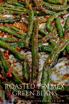 roasted texmex green beans with chili and seasoning on top in a pan