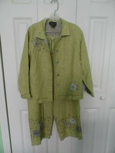 Woman's size Large Lime Green Linen Two Piece Pant Suit with Floral Embroidery Fine condition 2 piece jacket and pants pant suit in size large from Carol Anderson. Elastic waist as well as a drawstring. Floral design on the pants hem as well as the jacket. 100% linen. Shipping and handling is only $8.55. Spring Embroidered Linen Sets, Embroidered Linen Long Sleeve Sets, Spring Embroidered Fitted Pant Set, Fitted Embroidered Pant Set For Spring, Pant Suit, Floral Embroidery, Lime Green, Military Jacket, 2 Piece