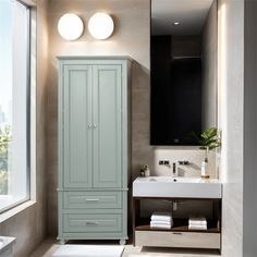 a white sink sitting next to a tall green cabinet