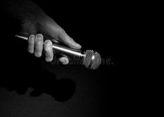 a hand holding a microphone in black and white royalty images, clippings stock photos