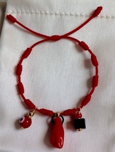 New Baby Red Knot Bracelet, good luck charm. Red evil eye, red hand and azabache. GOLD FILLED GENUINE 100%  These bracelets are extremely popular in the Spanish community. Usually bought and blessed for the new born to wear before leaving the hospital. Red Spiritual Bracelet For Good Luck, Spiritual Red Bracelet For Good Luck, Handmade Red Bracelets For Blessing, Handmade Red Bracelet For Blessing, Traditional Red Bracelets For Blessing, Traditional Red Jewelry For Good Luck, Traditional Red Jewelry For Blessing, Handmade Red Evil Eye Bracelet For Gift, Handmade Red Evil Eye Bracelet As A Gift