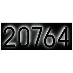 a black and white sign that says 20764