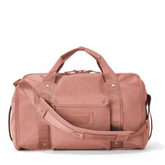 Front view of Monaco garment duffle in warm dust Pink Weekender Bag With Luggage Sleeve For Everyday, Pink Weekender Bag With Luggage Sleeve, Pink Travel Bag With Removable Pouch For Weekend Trips, Functional Pink Rectangular Weekender Bag, Functional Pink Travel Bag For Everyday, Functional Pink Travel Accessories For Weekend Trips, Pink Functional Everyday Travel Bag, Everyday Functional Pink Travel Bag, Pink Duffle Bag With Removable Pouch For Everyday Use