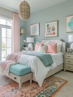 a bedroom decorated in pastel colors with pink and blue accents