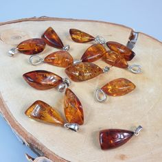 Welcome to handmade Baltic Amber jewelry shop. This Item is made of genuine, natural Amber. This item will make You look simple but gorgeous. Real natural Baltic Amber pendant. Handmade of real healing gemstone. Unisex style. Will be perfect gift for him or her. Small and tiny gemstone cabochons.   Length: ~  2.2 - 2.5 - 3 cm, You will get one Random pendant. Very light gemstone.  Our handmade jewelry is made with passion and love. If you have any problems with your order please contact us. Please note that colors can vary from originals depending on computer monitor's settings. Due to amber is being unique and natural gemstone, each item may be slightly different in shades or shapes. Items may have natural imperfections like lines and spots, specks, coloration and inclusions, layers and l Handmade Baltic Amber Teardrop Jewelry, Handmade Baltic Amber Spiritual Jewelry, Handmade Baltic Amber Jewelry Gift, Handmade Baltic Amber Jewelry For Gifts, Amber Gemstones For Gifts, Artisan Amber Jewelry With Natural Inclusions, Baltic Amber Jewelry With Natural Stones For Gifts, Artisan Amber Gemstones As Gift, Insect Ring