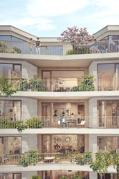 an apartment building with balconies and plants growing on the balconies