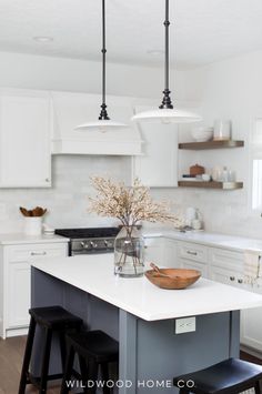 A kitchen island with seating not only adds extra dining options but also maximizes space. In this remodel, we had smaller custom cabinets built to gain extra inches while keeping full-depth end panels. This created the perfect spot for stools to tuck in, enhancing both style and function. Explore how our design blends practicality and aesthetic in this kitchen remodel for a space that's both inviting and efficient! Visit Wildwood Home Co at wildwoodhomecompany.com. Farmhouse Island Kitchen, Contrasting Kitchen Island, Small Kitchen Island, Kitchen Cabinet Styles