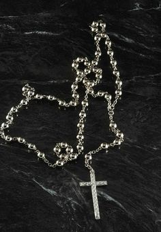 "For sale is a vintage rosary beaded cross necklace. This necklace is silver tone metal with silver tone metal beads. The cross measures 3/4 x 1 1/2\". The rosary chain measures 24\" with a 3 1/2\" drop. New Treasures added all the time. Check back often!" Silver Cross Rosary Bracelet, Silver Cross Necklace With Beaded Chain, Silver Beaded Chain Rosary, Silver Cross Rosary Spiritual, Spiritual Silver Cross Rosary, Silver Cross-shaped Rosary Bracelet With 8mm Beads, Nickel-free Silver Cross Rosary, Silver Beaded Cross Necklace For Gift, Silver Rosary With 8mm Beads And Crucifix