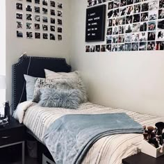 a small bedroom with pictures on the wall