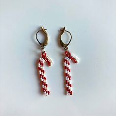 Handmade Beaded Candy Cane Earrings, 2” Long Including The Metal, The Beading Alone Hangs 1.25” Long. Seed Bead Christmas Earring Patterns, Beaded Santa Earrings Pattern, Crochet Candy Cane Earrings, Candy Cane Beaded Earrings, Beaded Candy Cane Earrings, Handmade White Beaded Earrings For Christmas, White Beaded Dangle Earrings For Christmas, White Beaded Christmas Dangle Earrings, White Christmas Beaded Dangle Earrings