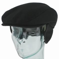 a mannequin's head wearing a black beret on a white background