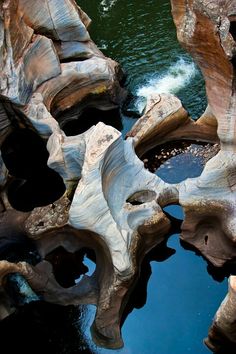 an aerial view of the water and rock formations