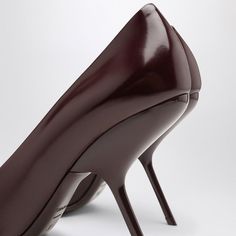 Step into elegance with these burgundy pumps that effortlessly blend classic style with modern flair. They're the kind of shoes that make you feel like you can conquer the world, or at least the dance floor. Perfect for pairing with your favorite outfits, they add a touch of sophistication to any occasion. Features a chic pointed toe design Contoured high heel for an elegant lift Crafted from luxurious burgundy patent leather Durable leather sole for comfort and longevity Expertly made in Italy Burgundy Pumps, Kinds Of Shoes, Patent Leather Pumps, Pumps Flat, Italian Luxury, Crossbody Tote, Toe Designs, Leather Pumps, Boot Sandals