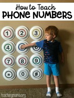 a young boy standing in front of a phone number board with the words how to teach phone numbers on it