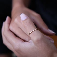 Slender, delicate thumb ring. Feminine and eye-catching. Gorgeous worn alone, or as part of a stacking set. SKINNY THUMB RING DETAILS Available in 100% Sterling Silver, 9ct and 18ct Gold All raw materials/gemstones are ethically sourced SIZE Each ring is hand-forged to order in our Northumberland Studio. Please choose your ring size and metal options from the drop down menu. THE CRAFTING JOURNEY Handcrafted in my Northumberland Studio, these simple and delicate rings are gently hammered to catch Antique Wedding Jewelry, Gold Thumb Rings, Jewerly Ring, Thumb Rings Silver, Hammered Rings, Thumb Ring, Gold Ring Stack, Gold Halo, Wedding Band Sets