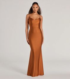 Made to celebrate enchanting evenings, the Virginia mermaid formal dress is a stunning option for bridesmaids, wedding guests, or attending soirees! The cowl neckline and spaghetti straps add a touch of elegance, while the open tie-back design allows for a sultry reveal. The mermaid silhouette and floor-length hem create a flattering and sophisticated look. Style this formal dress with dainty earrings and heels.Fit & FeaturesSleek knit fabric, moderate stretchCowl necklineSpaghetti strapsOpen tie-back designMermaid silhouetteSticky bra or pasties recommendedRuns true to size Elegant Satin Fishtail Evening Dress, Formal Mermaid Gown For Prom Season, Elegant Satin Fishtail Gown, Glamorous Mermaid Bridesmaid Dress For Prom Season, Fitted Mermaid Silhouette Evening Dress For Formal Events, Formal Mermaid Evening Dress With Sweep Train, Elegant Mermaid Gown For Prom Season, Elegant Mermaid Dress With Fitted Bodice, Elegant Mermaid Gown With Sweep Train