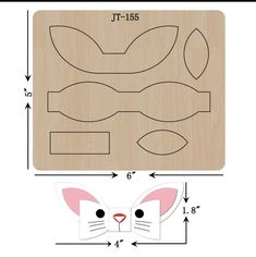 a wooden cutting board with an image of a cat's face on it and measurements for