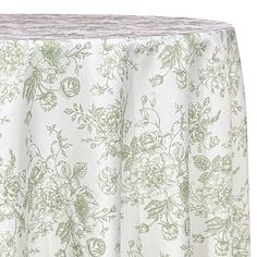 a white table cloth with green flowers on it