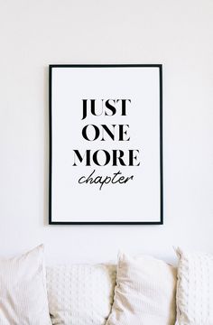 a black and white poster with the words just one more chance on it above a couch